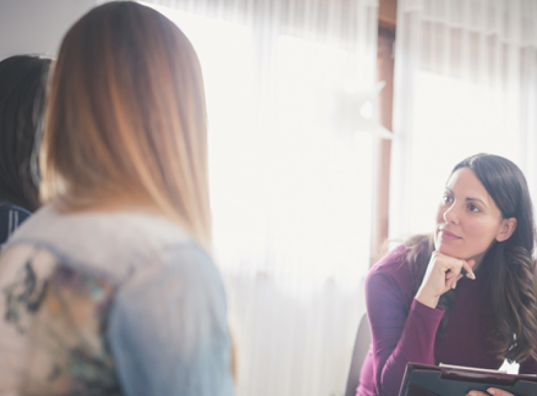 Counsellor listening to patients in a group session
